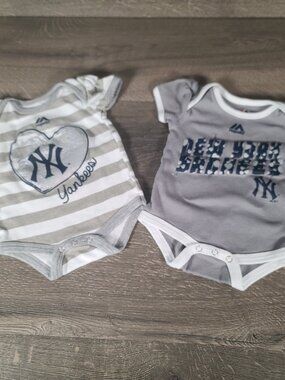 Lot of 2 Majestic New York Yankee Baby Girl's Size 0-3 Onesies.